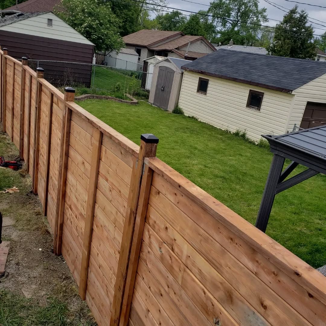 New horizontal picket fence along the same property line