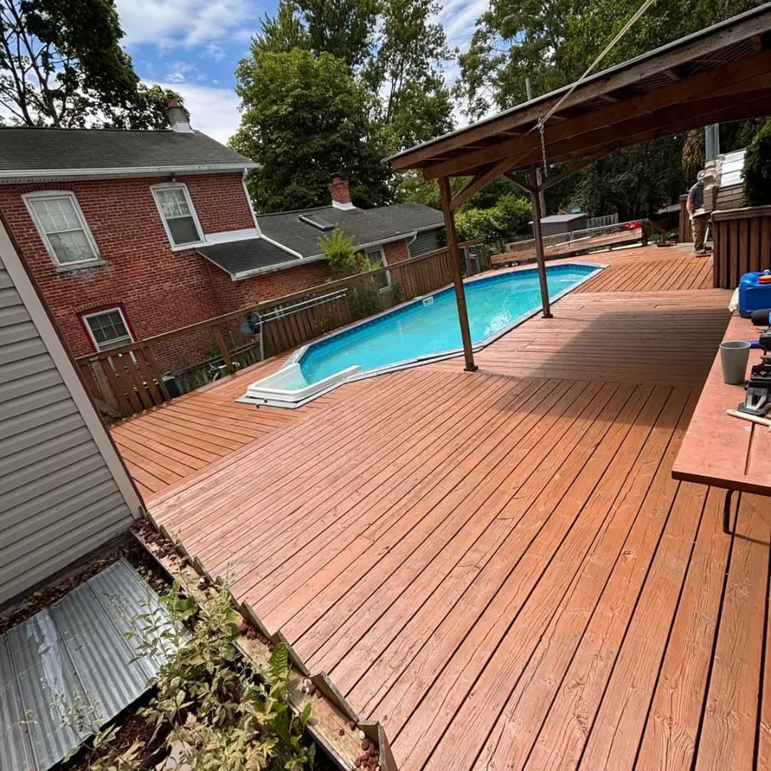 Wide view of the finished pool deck and railing