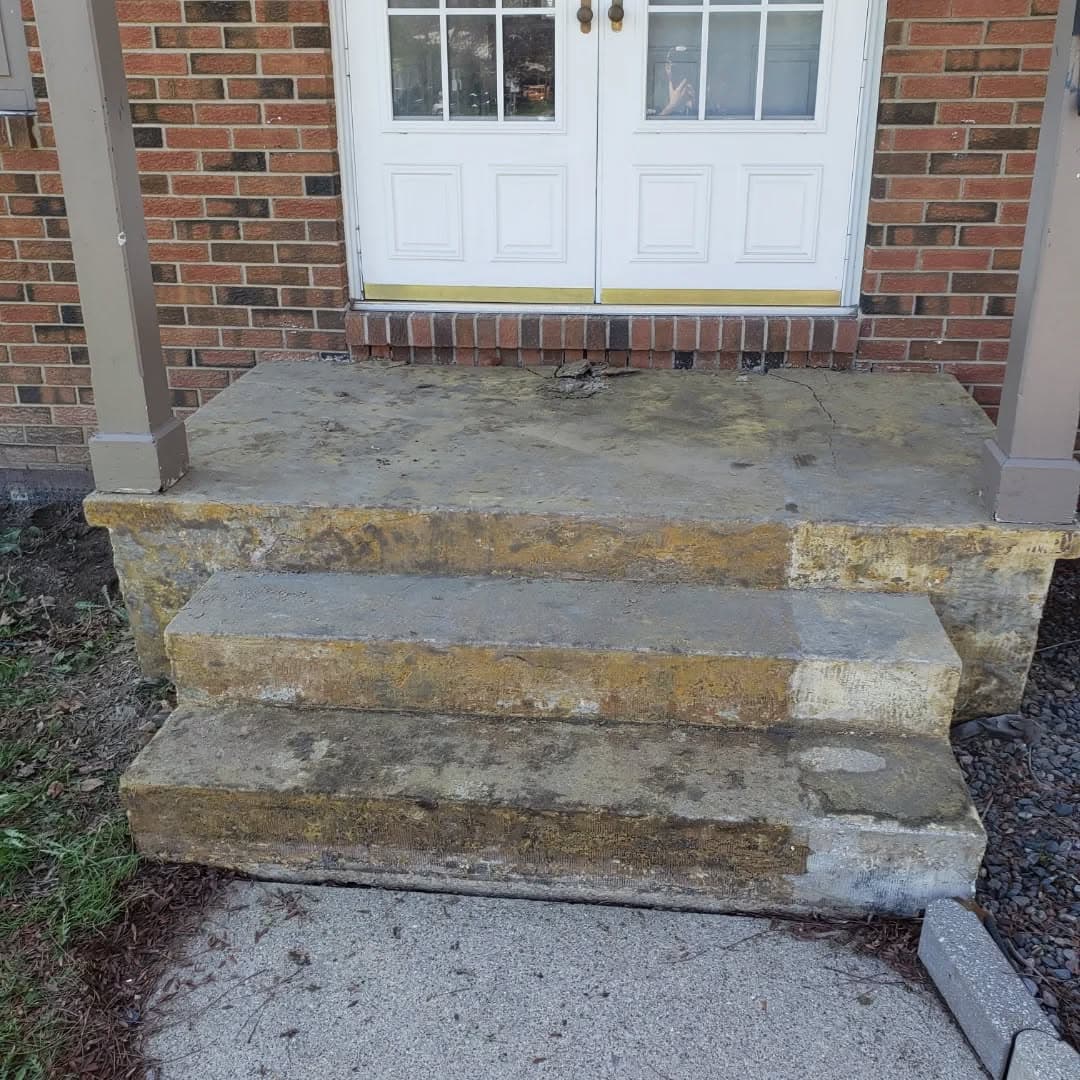 Porch mid-demolition with old carpet and glue removed