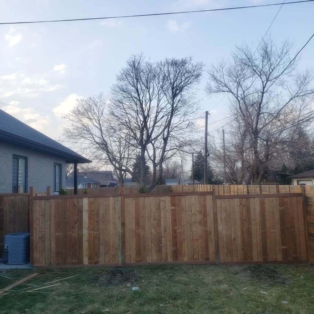 Completed privacy fence along the yard